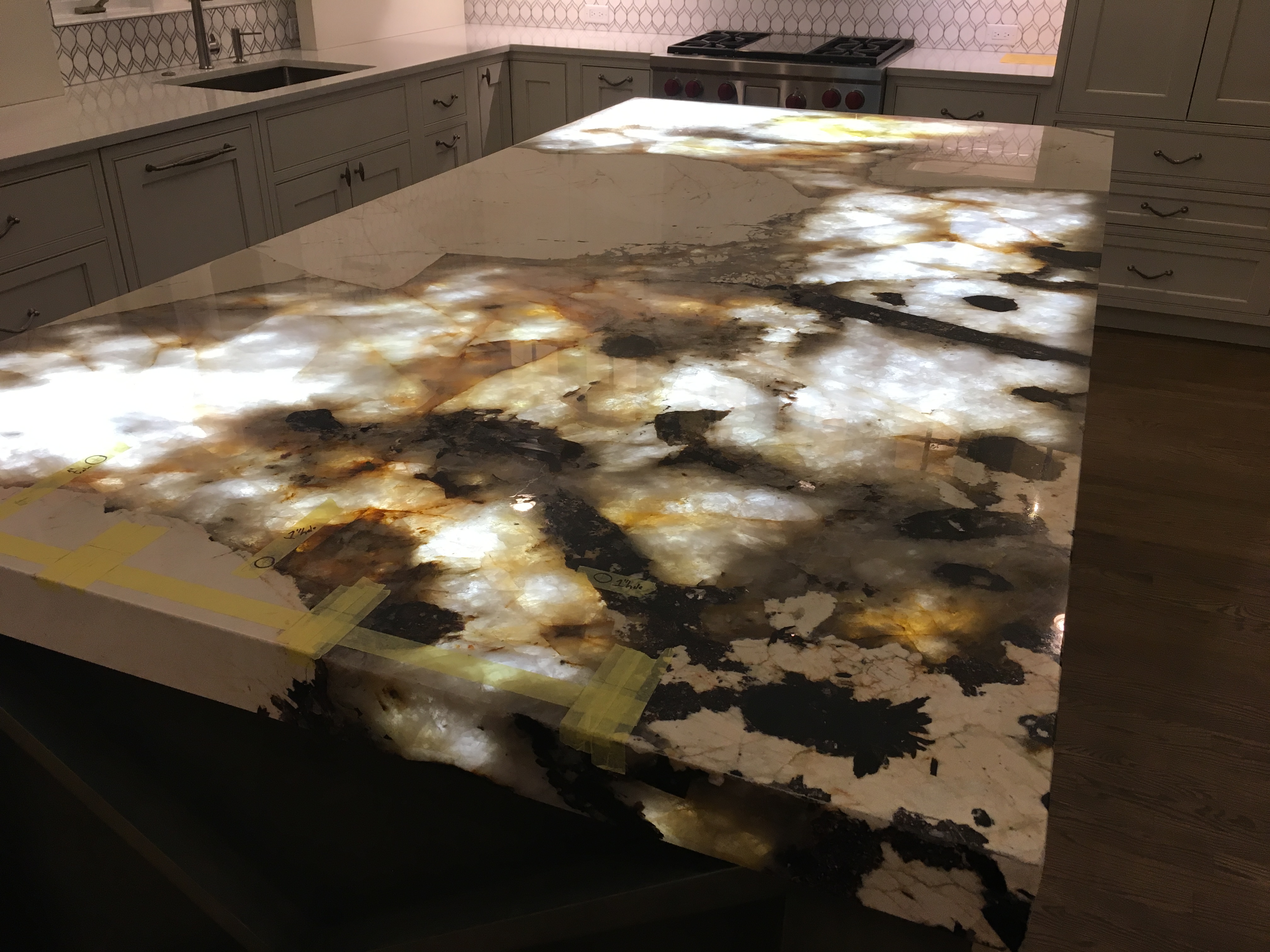 YK Stone Center fabrication shop denver, patagonia kitchen island, glowing quartz