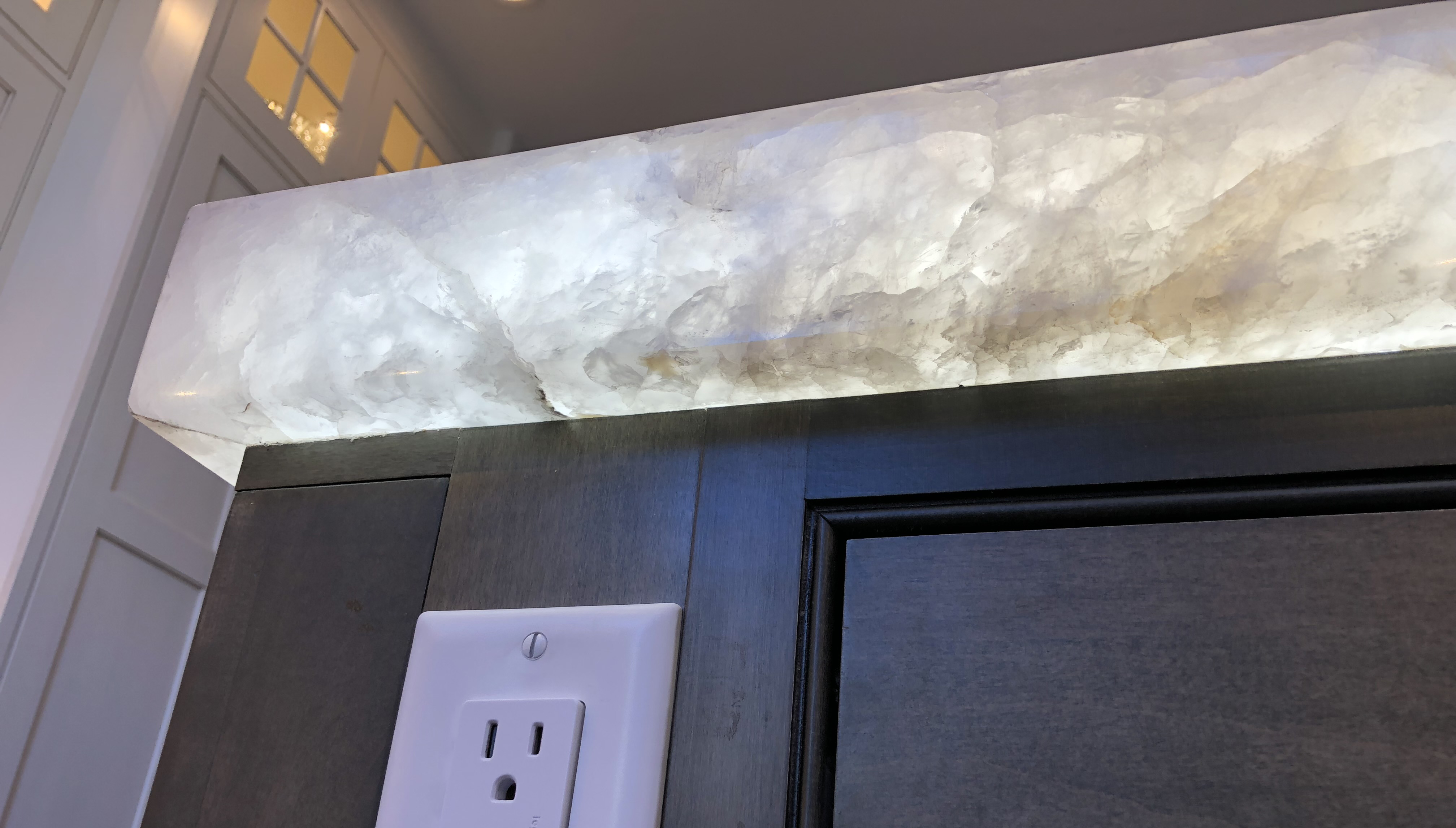 LED under countertop pannel. quartz glowing, kitchen countertop